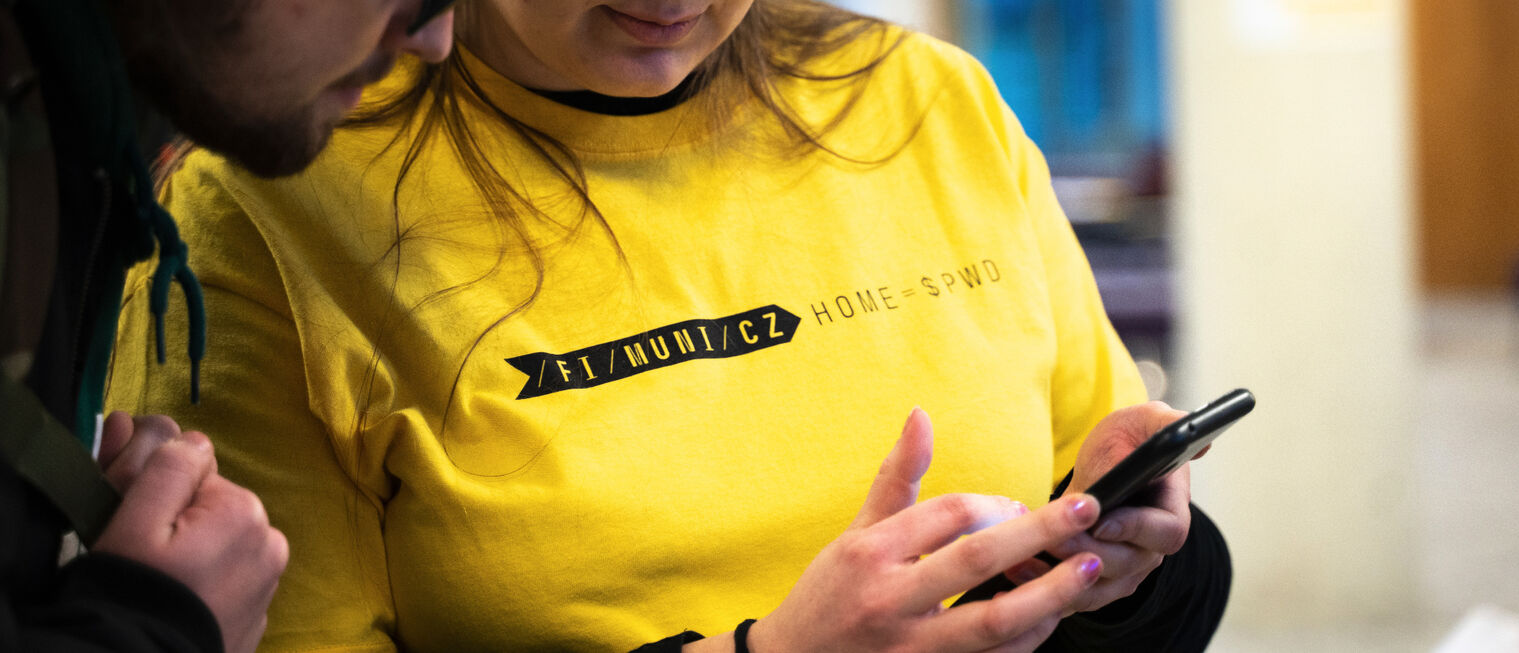 Close-up of the FI MU is HOME T-shirt